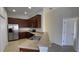 Modern kitchen featuring stainless steel appliances, granite countertops, and ample cabinet space at 10711 Yellow Tiger Lily Dr # S, Orlando, FL 32832