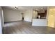 Spacious living room with modern flooring, a ceiling fan, and an archway leading to other rooms at 10711 Yellow Tiger Lily Dr # S, Orlando, FL 32832