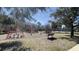 Community playground featuring multiple play structures and tennis court in the background at 10711 Yellow Tiger Lily Dr # S, Orlando, FL 32832
