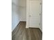 Walk-in closet with wire shelving and modern flooring, providing ample storage space for clothing at 10711 Yellow Tiger Lily Dr # S, Orlando, FL 32832