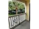 Balcony view features a well-maintained parking lot, trees, and landscaping at 1081 S Hiawassee Rd # 723, Orlando, FL 32835