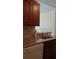 Kitchen features granite countertops, a stainless steel sink, and wood cabinets at 1081 S Hiawassee Rd # 723, Orlando, FL 32835