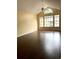Spacious living room with light yellow walls, hardwood floors, a ceiling fan, and lots of windows at 1081 S Hiawassee Rd # 723, Orlando, FL 32835