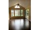 Bright living room with vaulted ceiling, lots of windows, and sliding door to balcony at 1081 S Hiawassee Rd # 723, Orlando, FL 32835