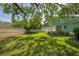 Lush backyard offering ample space, green grass, and secure fencing at 1111 Guernsey St, Orlando, FL 32804