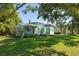 Charming home with manicured lawn and lovely curb appeal at 1111 Guernsey St, Orlando, FL 32804