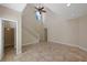 Bright, open-concept living area featuring tile floors, vaulted ceilings and staircase access at 1111 Guernsey St, Orlando, FL 32804