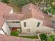 Aerial view showcasing a well-maintained home with brick accents, vibrant greenery, and a cozy patio at 117 Starling Ln, Longwood, FL 32779