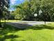 Outdoor basketball court surrounded by lush greenery and trees, offering a great recreational space at 117 Starling Ln, Longwood, FL 32779