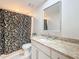 Updated bathroom with granite countertop vanity and shower featuring decorative curtain at 117 Starling Ln, Longwood, FL 32779