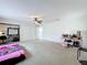 A well-lit bedroom with ample space, features a ceiling fan, closet and convenient vanity area at 117 Starling Ln, Longwood, FL 32779