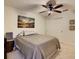 Inviting bedroom with neutral tones, natural light, ceiling fan, and convenient closet space at 117 Starling Ln, Longwood, FL 32779