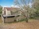 Back exterior view of home featuring a covered patio area with a large backyard at 117 Starling Ln, Longwood, FL 32779