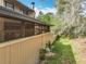 Home exterior highlighting a private patio and verdant greenery at 117 Starling Ln, Longwood, FL 32779