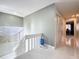 Bright hallway with tile flooring, neutral paint, and white trim offers a clean and modern aesthetic at 117 Starling Ln, Longwood, FL 32779