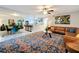 Open concept living room and dining area featuring tile floors, modern decor, and lots of natural light at 117 Starling Ln, Longwood, FL 32779