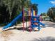 Community playground equipment including a blue slide and climbing structure set in a well-maintained sandy play area at 117 Starling Ln, Longwood, FL 32779