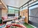 Cozy sunroom with comfortable seating, string lights, and a colorful rug creating a relaxing atmosphere at 117 Starling Ln, Longwood, FL 32779