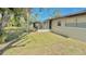 Spacious backyard with a screened-in porch provides a private outdoor retreat at 1420 Continental Dr, Daytona Beach, FL 32117