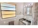 Clean bathroom with updated granite vanity, white tile, and modern fixtures at 1420 Continental Dr, Daytona Beach, FL 32117