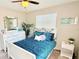Inviting bedroom with a bright window, modern decor, and laminate flooring at 1420 Continental Dr, Daytona Beach, FL 32117