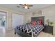 This is a bright bedroom with an accent wall decoration, closet, and black furniture set at 1420 Continental Dr, Daytona Beach, FL 32117