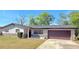 Charming single-story home with a well-maintained lawn and attached two-car garage at 1420 Continental Dr, Daytona Beach, FL 32117