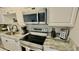 Beautiful stainless steel appliances and granite counters are the centerpieces of this spacious kitchen at 1420 Continental Dr, Daytona Beach, FL 32117