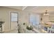 Bright kitchen and dining area combo with granite counters, white cabinets, and modern decor at 1420 Continental Dr, Daytona Beach, FL 32117