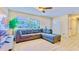 Cozy living room featuring a large sofa and lots of natural light at 1420 Continental Dr, Daytona Beach, FL 32117