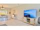 Bright and open living room and dining area featuring laminate flooring and neutral paint at 1420 Continental Dr, Daytona Beach, FL 32117