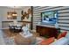Modern dining room with decorative wall art and a view of the living space at 145 Old Moss Cir, Deland, FL 32724