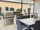 Outdoor kitchen and grill area with counterspace and a built in grill at 145 Old Moss Cir, Deland, FL 32724