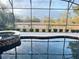 Close up view of a pool and spa overlooking a natural Florida landscape at 145 Old Moss Cir, Deland, FL 32724