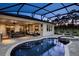 Screened-in pool and patio area featuring a built in spa, and outdoor seating at 145 Old Moss Cir, Deland, FL 32724