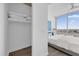 Spacious closet and bedroom boasts a scenic city view from the expansive window at 150 E Robinson St # 2308, Orlando, FL 32801