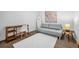 Bedroom featuring a sofa, surfboard, and desk on a light rug at 150 E Robinson St # 2308, Orlando, FL 32801