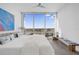 Bright bedroom features a spacious layout, stunning city views from large windows, and modern decor at 150 E Robinson St # 2308, Orlando, FL 32801