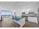 Bright, modern kitchen with stainless appliances, island, and open floor plan, offering stunning city views at 150 E Robinson St # 2308, Orlando, FL 32801