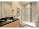 Bathroom featuring a granite countertop and modern shower with glass door at 1523 Still Dr, Clermont, FL 34714
