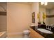Modern bathroom featuring a granite countertop, stylish mirror, and tiled shower at 1523 Still Dr, Clermont, FL 34714