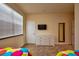 Bedroom featuring two twin beds, neutral carpet and a large window at 1523 Still Dr, Clermont, FL 34714