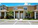 Inviting townhouse featuring a well-maintained lawn and a shared entrance, perfect for comfortable living at 1523 Still Dr, Clermont, FL 34714