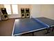 Entertaining game room with a ping pong table and fun arcade machines, perfect for Gathering fun at 1523 Still Dr, Clermont, FL 34714
