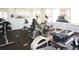 Well-equipped gym with cardio machines including treadmills, stationary bikes, and rowing machines for a complete workout at 1523 Still Dr, Clermont, FL 34714