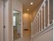 Hallway featuring white trim, staircase and front door at 1523 Still Dr, Clermont, FL 34714