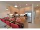 Well-equipped kitchen with stainless steel appliances, granite countertops, and a breakfast bar with seating at 1523 Still Dr, Clermont, FL 34714