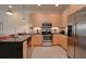 Modern kitchen featuring stainless steel appliances, sleek cabinetry, and ample counter space for cooking at 1523 Still Dr, Clermont, FL 34714
