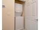 Efficient laundry space with stacked washer and dryer unit at 1523 Still Dr, Clermont, FL 34714
