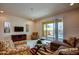 Cozy living room with sliding glass doors leading to a patio with pool views, perfect for relaxation at 1523 Still Dr, Clermont, FL 34714